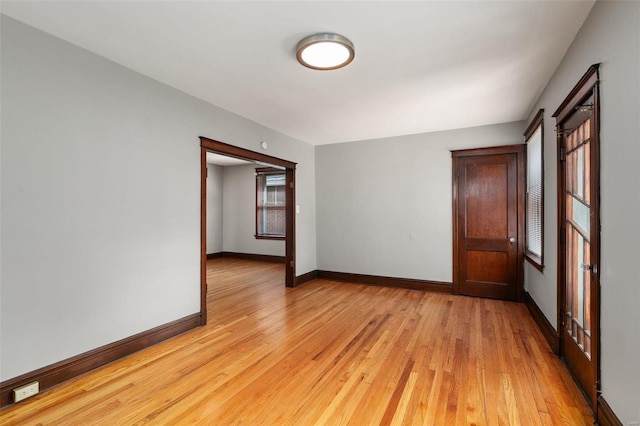 spare room with light hardwood / wood-style flooring