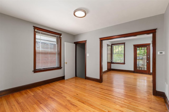 spare room featuring light hardwood / wood-style flooring