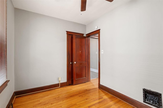 unfurnished room featuring light hardwood / wood-style floors and ceiling fan