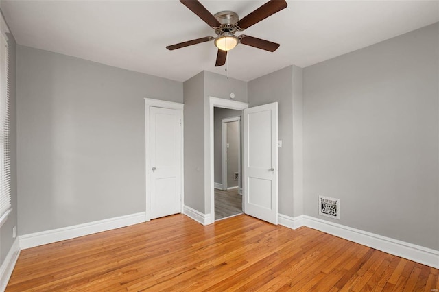 unfurnished bedroom with ceiling fan and light hardwood / wood-style floors