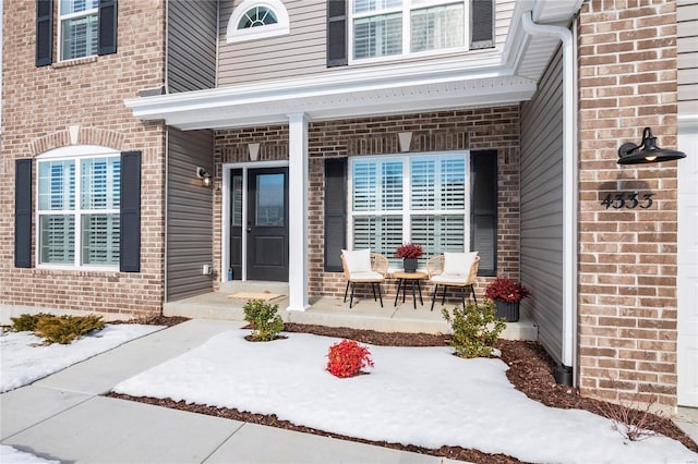 entrance to property featuring a porch