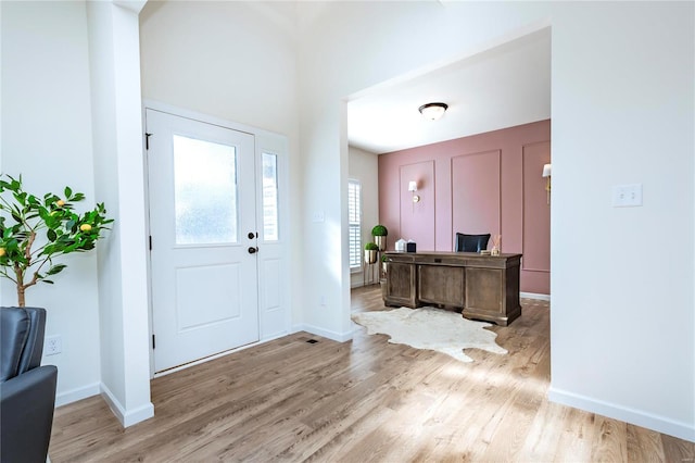 foyer with light wood-type flooring