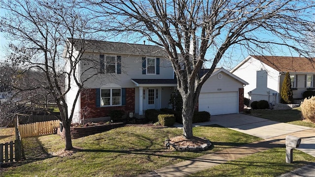 view of front of property with a garage and a front yard