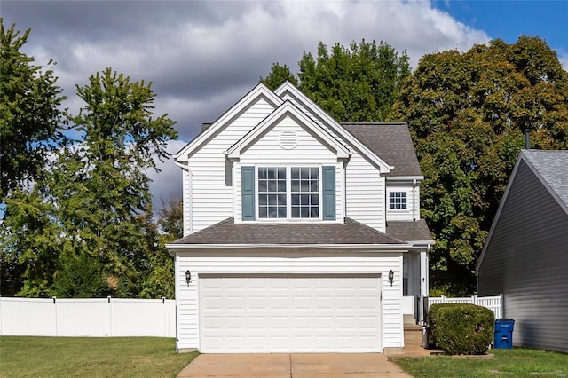 front facade featuring a front yard and a garage