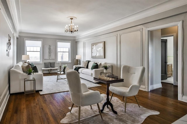 dining room with dark wood-type flooring, a chandelier, and ornamental molding