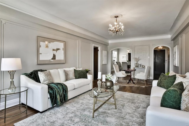 living room with hardwood / wood-style flooring and a chandelier