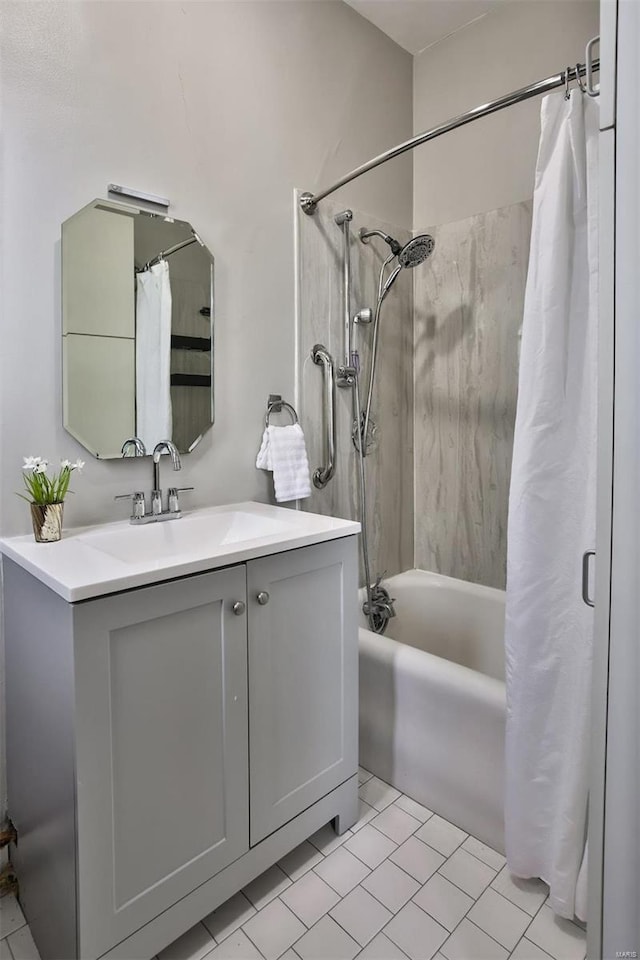 bathroom featuring vanity, shower / bathtub combination with curtain, and tile patterned floors