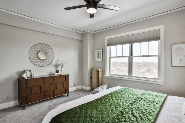 bedroom with ceiling fan, radiator heating unit, and carpet