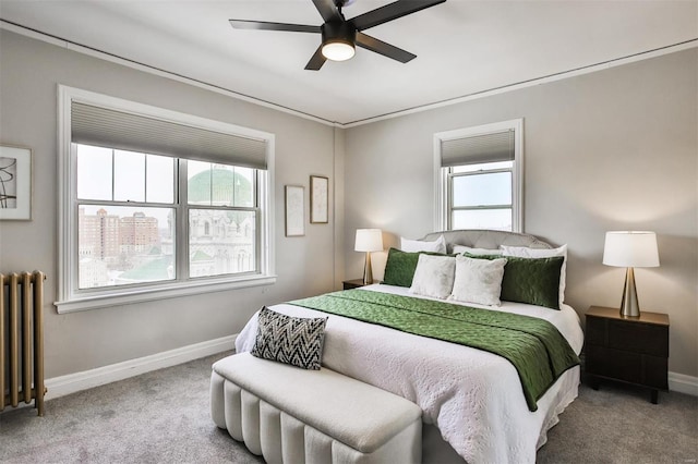 bedroom with baseboards, carpet, a ceiling fan, and radiator