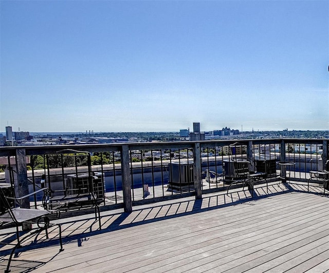 view of dock featuring a view of city and a balcony