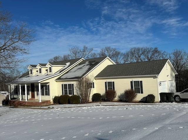 view of front of property with a porch and a garage