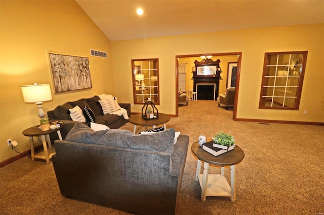 living room featuring vaulted ceiling and carpet floors