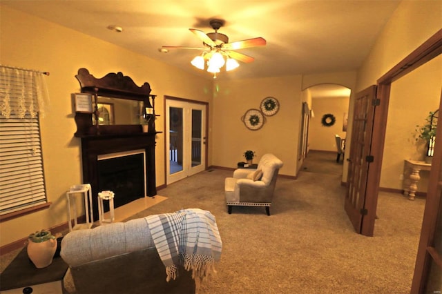 living room featuring ceiling fan and carpet floors