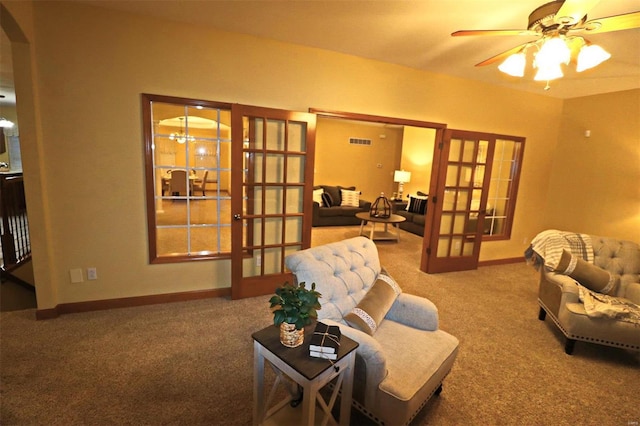 living room with ceiling fan, french doors, and carpet flooring