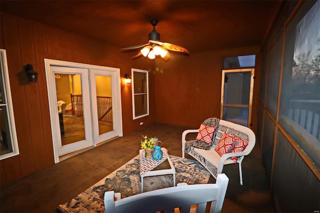 sunroom with ceiling fan and french doors