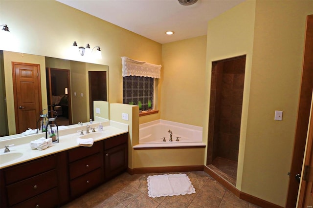 bathroom featuring vanity, independent shower and bath, and tile patterned flooring