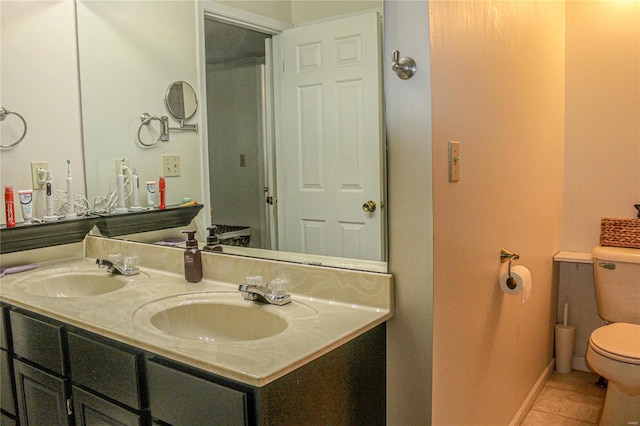 bathroom with vanity, tile patterned floors, and toilet