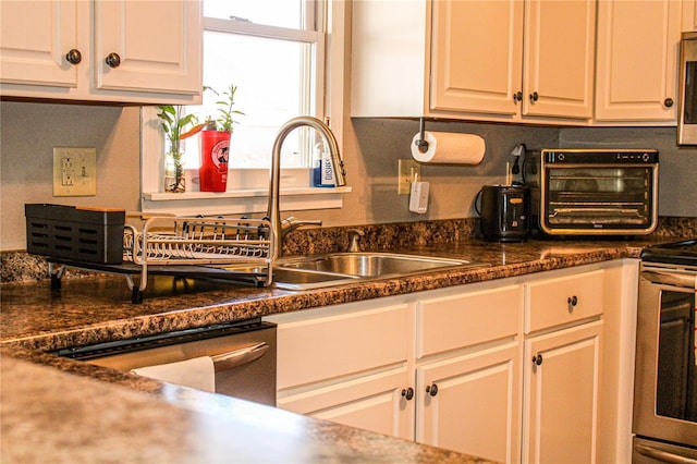 kitchen with stainless steel appliances and white cabinets