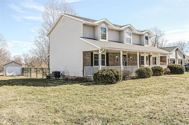 view of front of property with a porch, a garage, an outdoor structure, central AC unit, and a front lawn