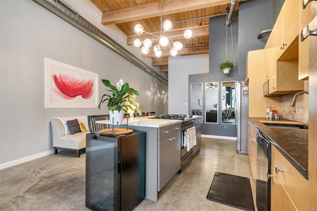 kitchen with black appliances, wood ceiling, light brown cabinetry, sink, and beam ceiling