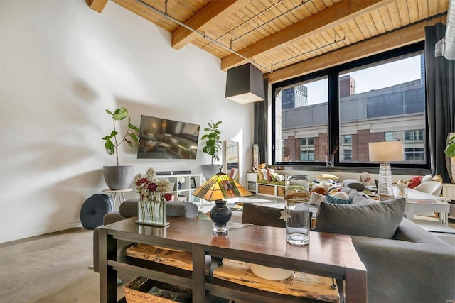 living room with wooden ceiling, concrete flooring, and beam ceiling