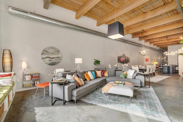 living room featuring wooden ceiling, beam ceiling, and a chandelier