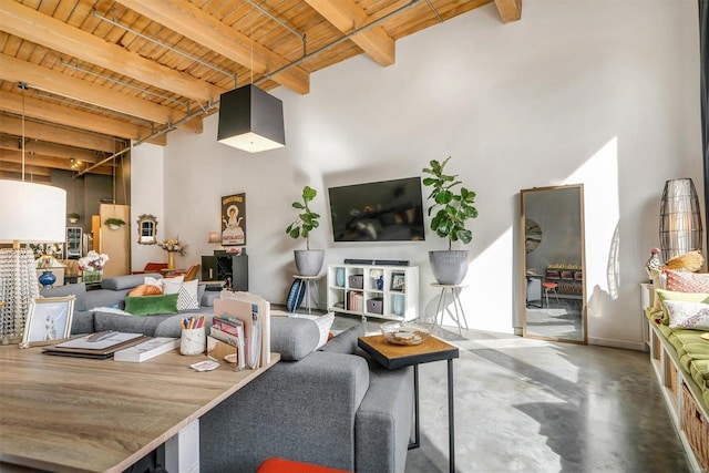 living room featuring concrete floors, beam ceiling, and wood ceiling