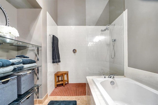 bathroom featuring tile patterned floors and shower with separate bathtub