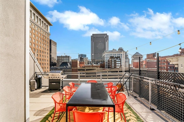 balcony featuring area for grilling