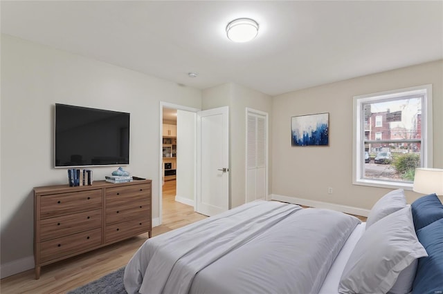 bedroom with light wood-type flooring