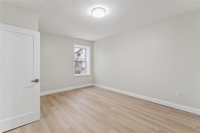 spare room featuring light hardwood / wood-style floors