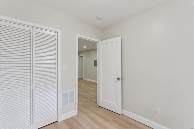 corridor featuring light hardwood / wood-style flooring