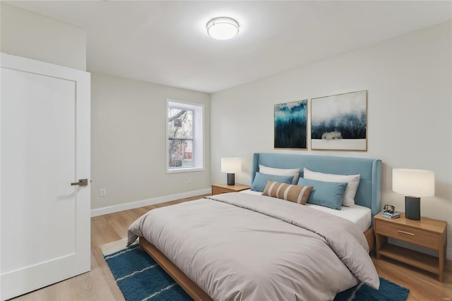 bedroom with light wood-type flooring