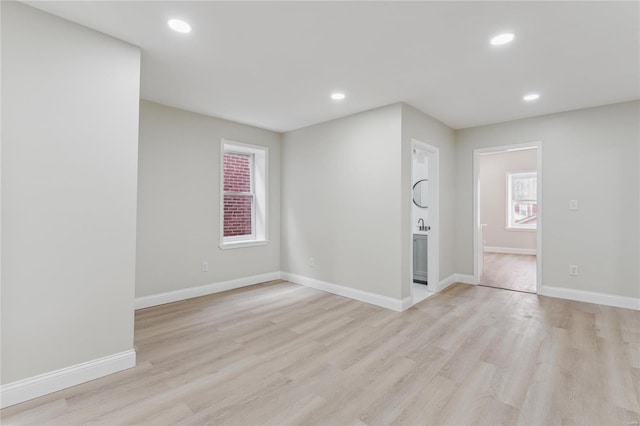 empty room with light hardwood / wood-style floors