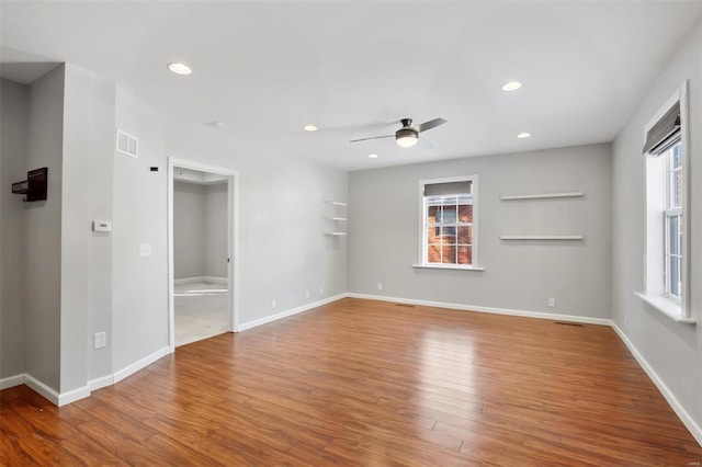 unfurnished room featuring hardwood / wood-style flooring and ceiling fan