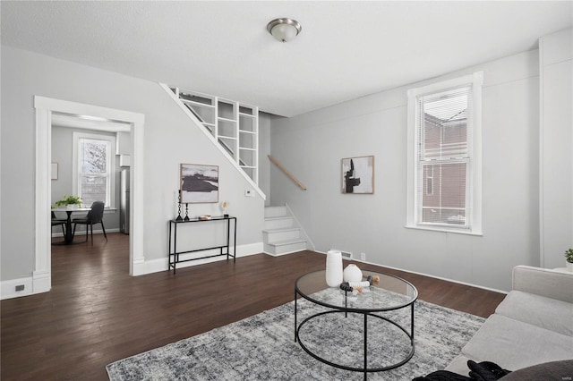 living room with dark hardwood / wood-style floors