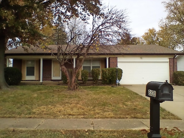 ranch-style house with a front yard and a garage