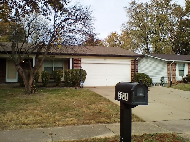 single story home featuring a front yard and a garage