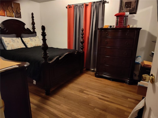 bedroom with light wood-type flooring