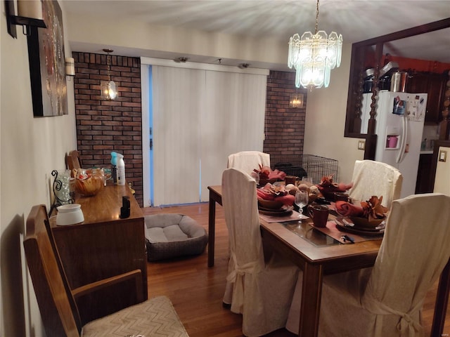 dining room featuring light hardwood / wood-style floors and a notable chandelier