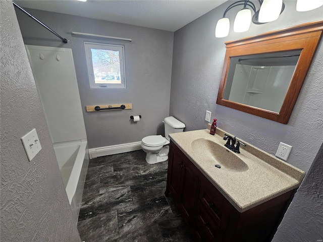 bathroom with toilet, baseboard heating, and vanity