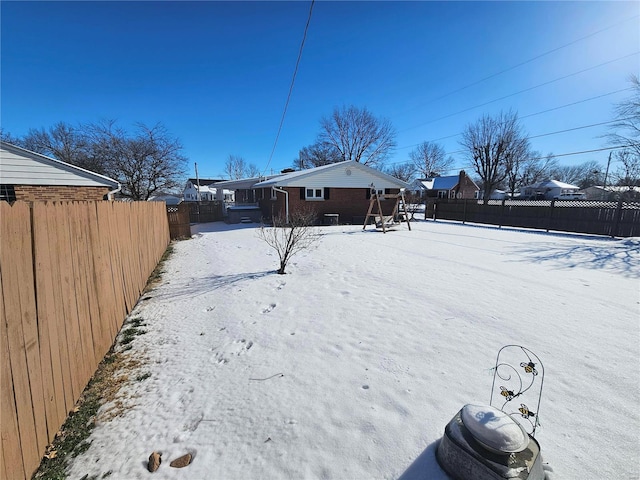 view of yard layered in snow