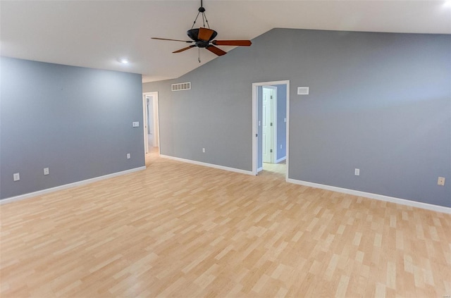 spare room with vaulted ceiling, light hardwood / wood-style floors, and ceiling fan