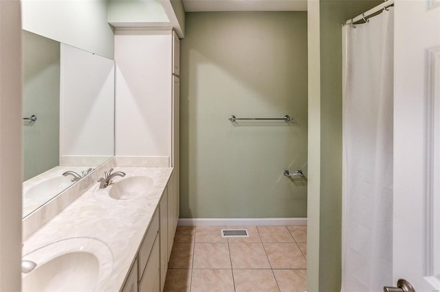 bathroom with vanity and tile patterned flooring