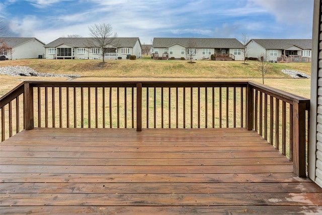 wooden deck with a lawn