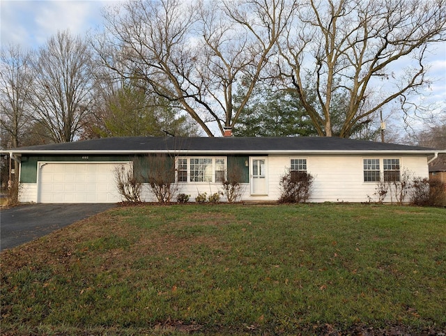 ranch-style home featuring a front lawn and a garage