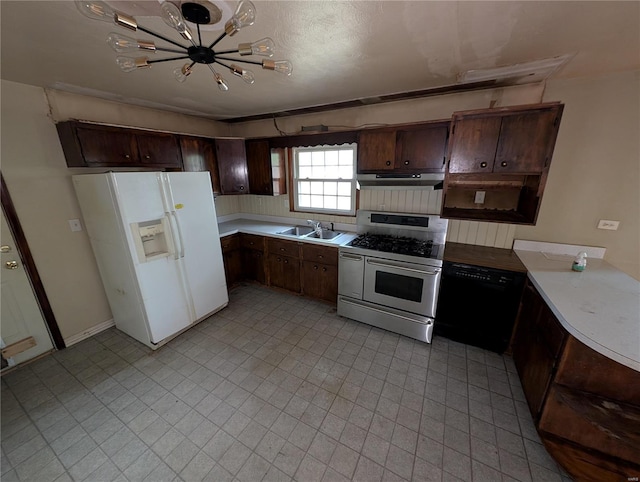 kitchen with sink, range with two ovens, dark brown cabinets, white refrigerator with ice dispenser, and a notable chandelier