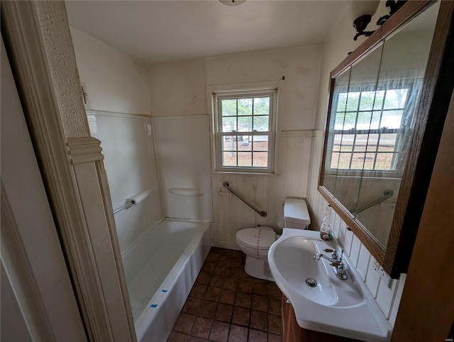 bathroom with toilet and vanity