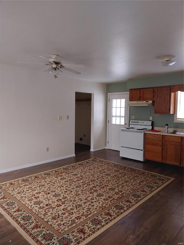 kitchen with white range with electric stovetop, ceiling fan, and dark wood-type flooring