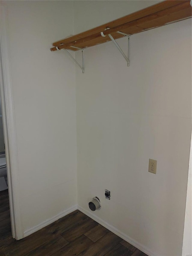 washroom featuring electric dryer hookup and dark hardwood / wood-style flooring